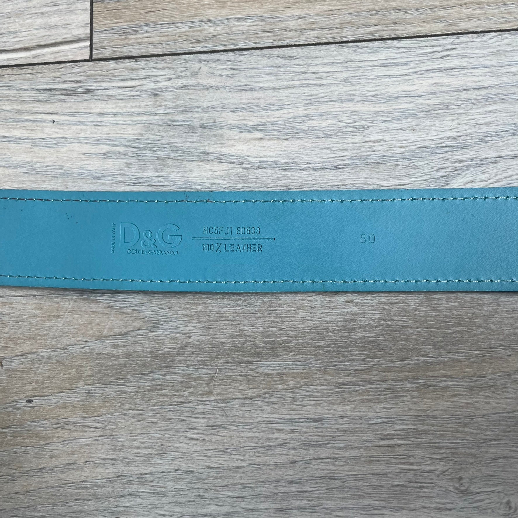 Dolce &amp; Gabbana 2008 Butterfly Buckle Baby Blue Leather Belt from the AW2008 collection. Crafted from smooth Baby Blue leather with visible edge stitching, this belt features a big silver-tone D&amp;G logo buckle shaped in a butterfly-style form. The buckle has a polished metal finish, while the belt itself is made from 100% leather and retains a clean, structured profile. An original seasonal accessory from Dolce &amp; Gabbana’s AW2008 season.
