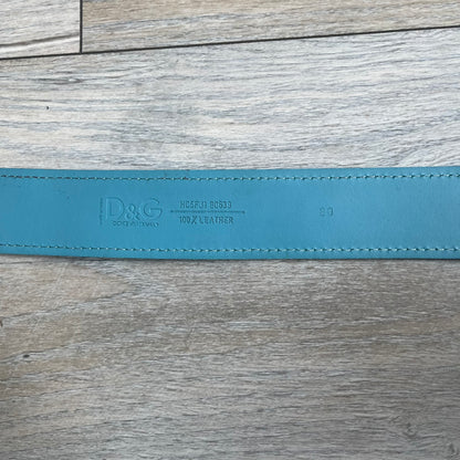 Dolce &amp; Gabbana 2008 Butterfly Buckle Baby Blue Leather Belt from the AW2008 collection. Crafted from smooth Baby Blue leather with visible edge stitching, this belt features a big silver-tone D&amp;G logo buckle shaped in a butterfly-style form. The buckle has a polished metal finish, while the belt itself is made from 100% leather and retains a clean, structured profile. An original seasonal accessory from Dolce &amp; Gabbana’s AW2008 season.