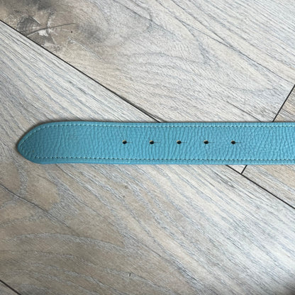Dolce &amp; Gabbana 2008 Butterfly Buckle Baby Blue Leather Belt from the AW2008 collection. Crafted from smooth Baby Blue leather with visible edge stitching, this belt features a big silver-tone D&amp;G logo buckle shaped in a butterfly-style form. The buckle has a polished metal finish, while the belt itself is made from 100% leather and retains a clean, structured profile. An original seasonal accessory from Dolce &amp; Gabbana’s AW2008 season.