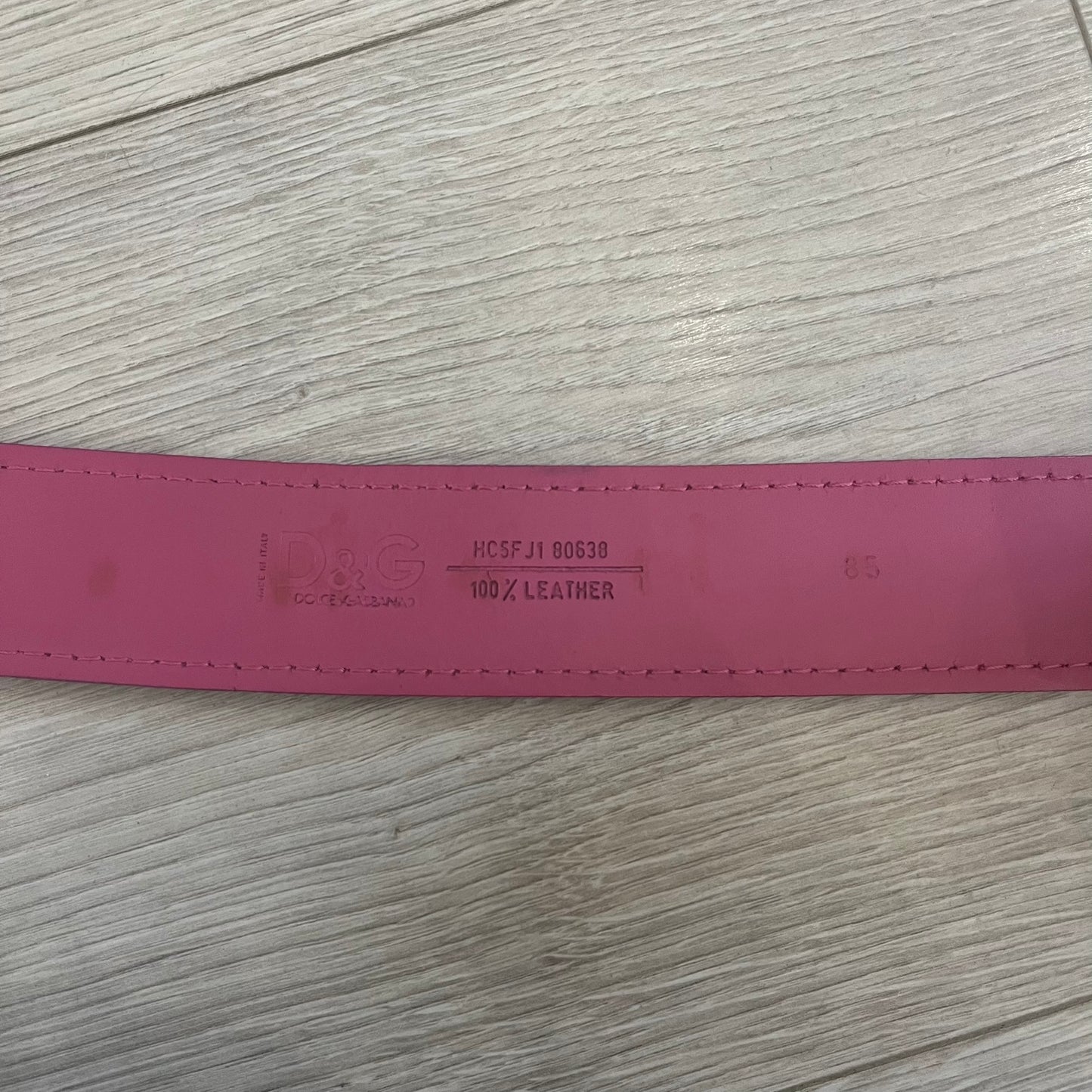 Dolce &amp; Gabbana 2008 Butterfly Buckle Pink Leather Belt from the AW2008 collection. Crafted from smooth pink leather with visible edge stitching, this belt features a big silver-tone D&amp;G logo buckle shaped in a butterfly-style form. The buckle has a polished metal finish, while the belt itself is made from 100% leather and retains a clean, structured profile. An original seasonal accessory from Dolce &amp; Gabbana’s AW2008 season.