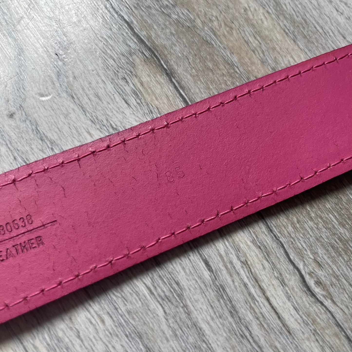 Dolce &amp; Gabbana 2008 Butterfly Buckle Pink Leather Belt from the AW2008 collection. Crafted from smooth pink leather with visible edge stitching, this belt features a big silver-tone D&amp;G logo buckle shaped in a butterfly-style form. The buckle has a polished metal finish, while the belt itself is made from 100% leather and retains a clean, structured profile. An original seasonal accessory from Dolce &amp; Gabbana’s AW2008 season.