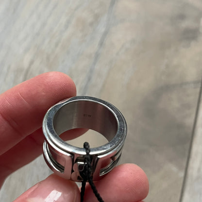 Dolce &amp; Gabbana 3D logo ring crafted in silver-tone metal with a unique two-part construction. The base is a classic band, topped with a raised layer that wraps the D&amp;G logo around the ring. Designed with a movable top section that spins, it’s a dynamic accessory merging playful function with signature branding.