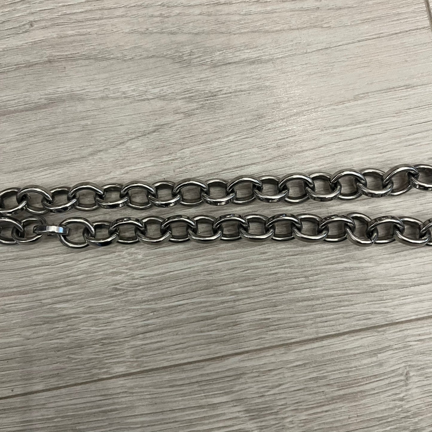 Dolce &amp; Gabbana Carabiner Chain Necklace features a robust stainless steel chain with a central carabiner engraved with the D&amp;G logo. The adjustable design includes a bolt-style clasp to modify the length, and the opposite end showcases a three-dimensional D&amp;G logo, blending industrial detailing with high-fashion appeal.