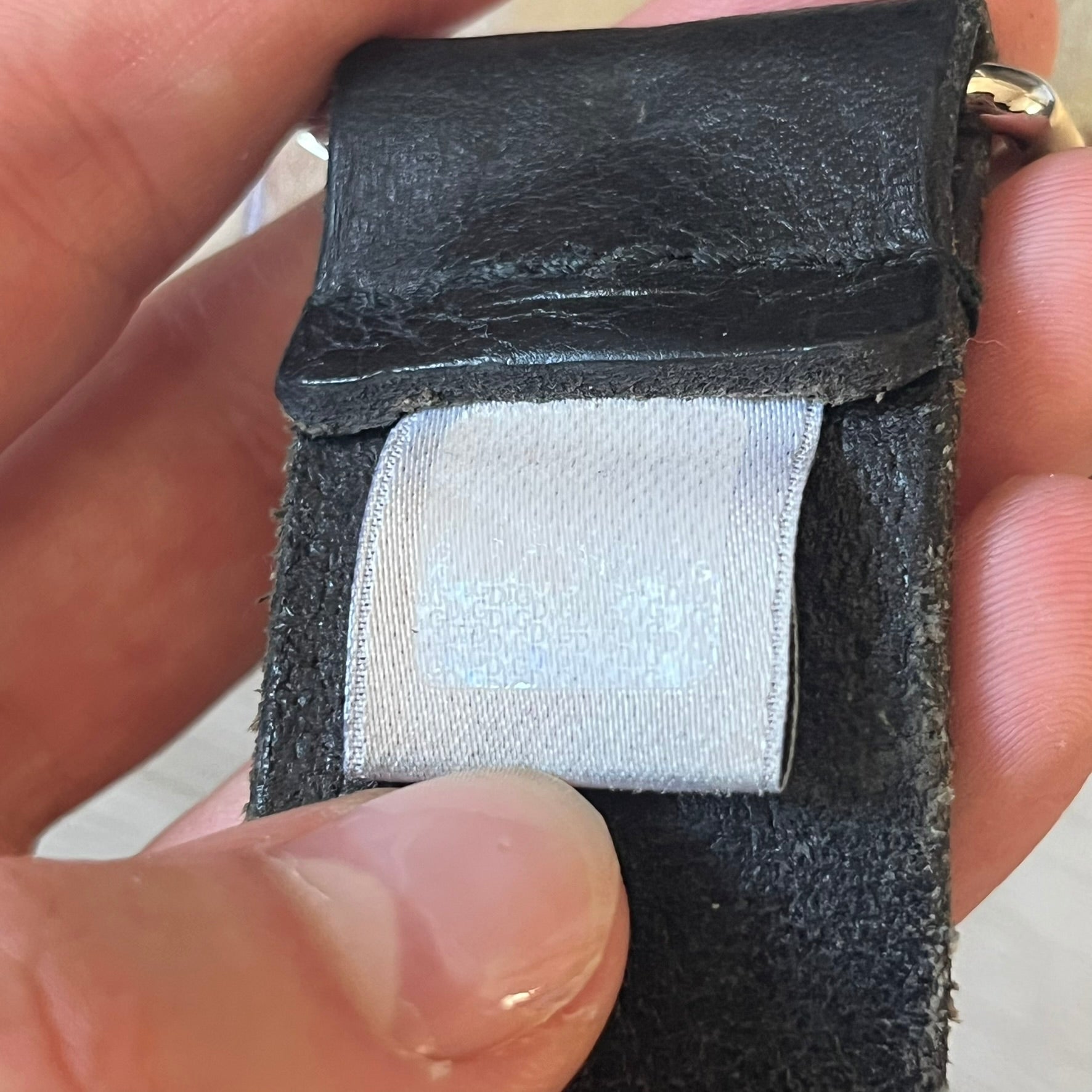 Dolce &amp; Gabbana “College Since 1994” belt featuring a pretty big crest-shaped buckle. The silver text overlays a white-and-black split crest, paired with a soft black leather strap for a refined yet edgy finish.