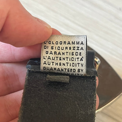  Dolce &amp; Gabbana “College Since 1994” belt featuring a pretty big crest-shaped buckle. The silver text overlays a white-and-black split crest, paired with a soft black leather strap for a refined yet edgy finish.
