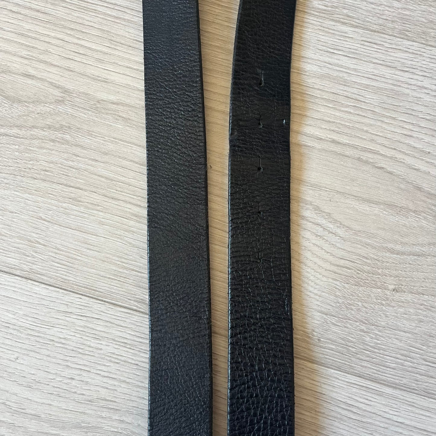  Dolce &amp; Gabbana “College Since 1994” belt featuring a pretty big crest-shaped buckle. The silver text overlays a white-and-black split crest, paired with a soft black leather strap for a refined yet edgy finish.