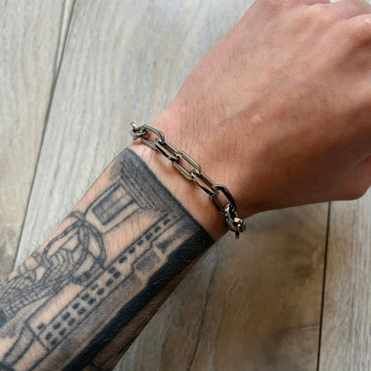 Dolce & Gabbana DJ0162 stainless steel bracelet designed as part of a multi-bracelet watch set, where three bracelets were supplied with the original watch. The piece features a paperclip chain construction and a T-bar clasp fastening. D&G branding appears engraved on the T-bar and on the circular ring element of the clasp.