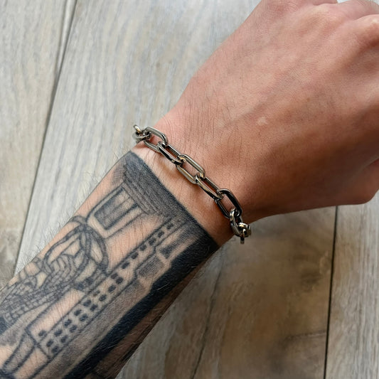 Dolce & Gabbana DJ0162 stainless steel bracelet designed as part of a multi-bracelet watch set, where three bracelets were supplied with the original watch. The piece features a paperclip chain construction and a T-bar clasp fastening. D&G branding appears engraved on the T-bar and on the circular ring element of the clasp.