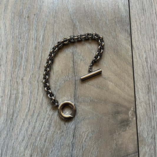 Dolce & Gabbana DJ0162 stainless steel bracelet from a three-bracelet watch set release. Constructed with round link chain segments and secured with a T-bar clasp. The clasp hardware includes engraved D&G branding on the T-bar and on the circular locking ring.