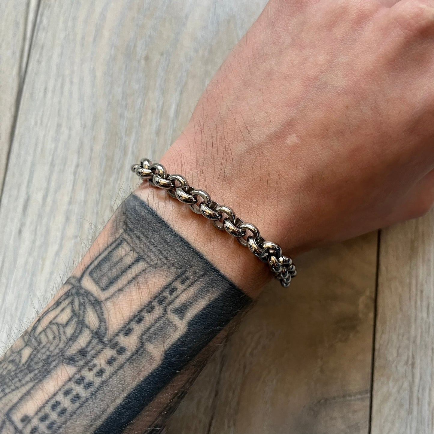 Dolce & Gabbana DJ0162 stainless steel bracelet from a three-bracelet watch set release. Constructed with round link chain segments and secured with a T-bar clasp. The clasp hardware includes engraved D&G branding on the T-bar and on the circular locking ring.