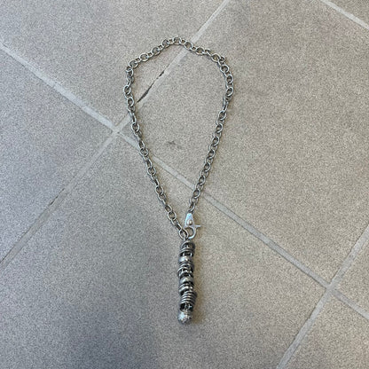 Dolce &amp; Gabbana DJ0776 Crystal Ring Link Necklace features a long stainless steel chain with freely moving rings, including basic loops, D&amp;G-engraved rings and crystal-set rings. The necklace has a large clasp, while the end is finished with a ball featuring D&amp;G logos all around it.