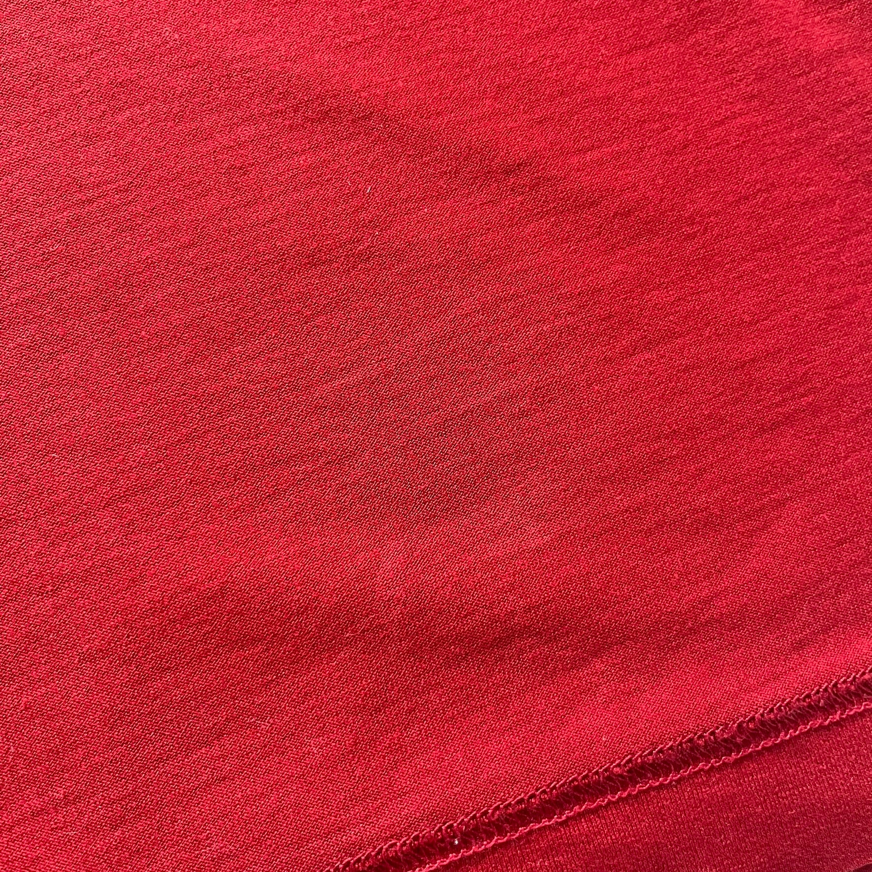 Dolce &amp; Gabbana Fall 2011 tee in vibrant red featuring a simple “Drink Coca-Cola” logo on the chest. Designed with an inside-out stitching aesthetic and a subtle back logo under the collar. A unique, collectible tee that merges casual branding with high-fashion flair.