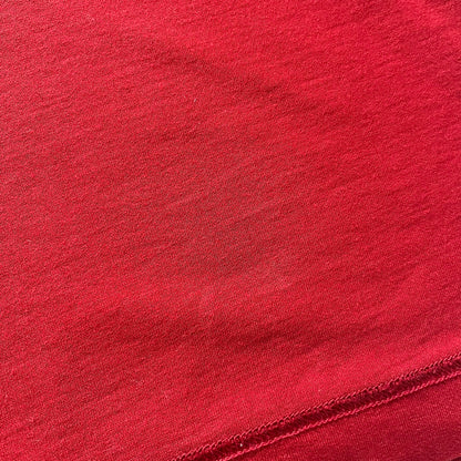 Dolce &amp; Gabbana Fall 2011 tee in vibrant red featuring a simple “Drink Coca-Cola” logo on the chest. Designed with an inside-out stitching aesthetic and a subtle back logo under the collar. A unique, collectible tee that merges casual branding with high-fashion flair.