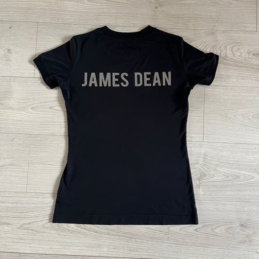 This Dolce &amp; Gabbana James Dean Black Tee features a premium Italian-made cotton construction with a front portrait of James. The design includes pretty big white/grey “James Dean” text across the upper back. The t-shirt celebrates the lasting influence of James Dean, a defining figure of mid-century cinema.