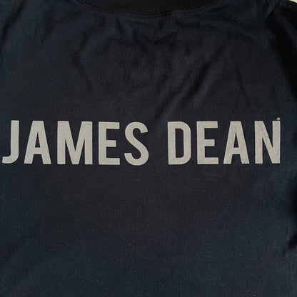 This Dolce &amp; Gabbana James Dean Black Tee features a premium Italian-made cotton construction with a front portrait of James. The design includes pretty big white/grey “James Dean” text across the upper back. The t-shirt celebrates the lasting influence of James Dean, a defining figure of mid-century cinema.