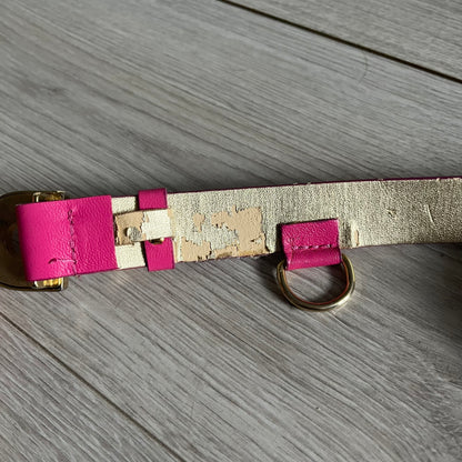 This Dolce &amp; Gabbana Belt combines a slim pink design with a statement D&amp;G buckle framed in gold and accented by visible screws. The inner side of the belt features a gold finish, highlighting the brand’s attention to material contrast. A classic Italian accessory crafted with detailed hardware.