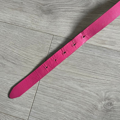 This Dolce &amp; Gabbana Belt combines a slim pink design with a statement D&amp;G buckle framed in gold and accented by visible screws. The inner side of the belt features a gold finish, highlighting the brand’s attention to material contrast. A classic Italian accessory crafted with detailed hardware.