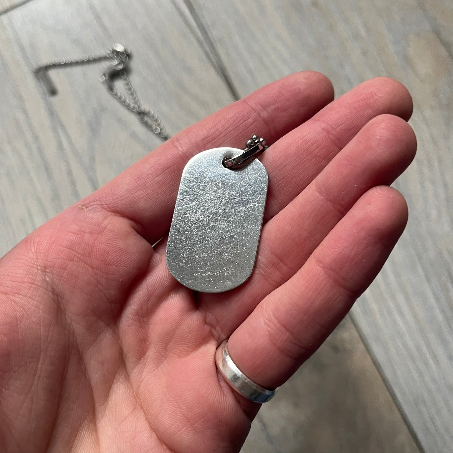 Dolce &amp; Gabbana plain logo dog tag necklace in silver-tone stainless steel, featuring the iconic D&amp;G logo engraved on a sleek tag. Suspended on a classic ball chain with a regulated size. A versatile accessory that combines minimal branding with everyday wearability.