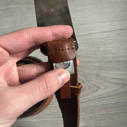 Dolce &amp; Gabbana Red &amp; Blue Leather Belt featuring a rectangular silver-tone buckle with a navy border. The buckle displays a large D&amp;G logo in blue with a red outline and “Dolce &amp; Gabbana” text in blue beneath. Finished with a brown leather strap.