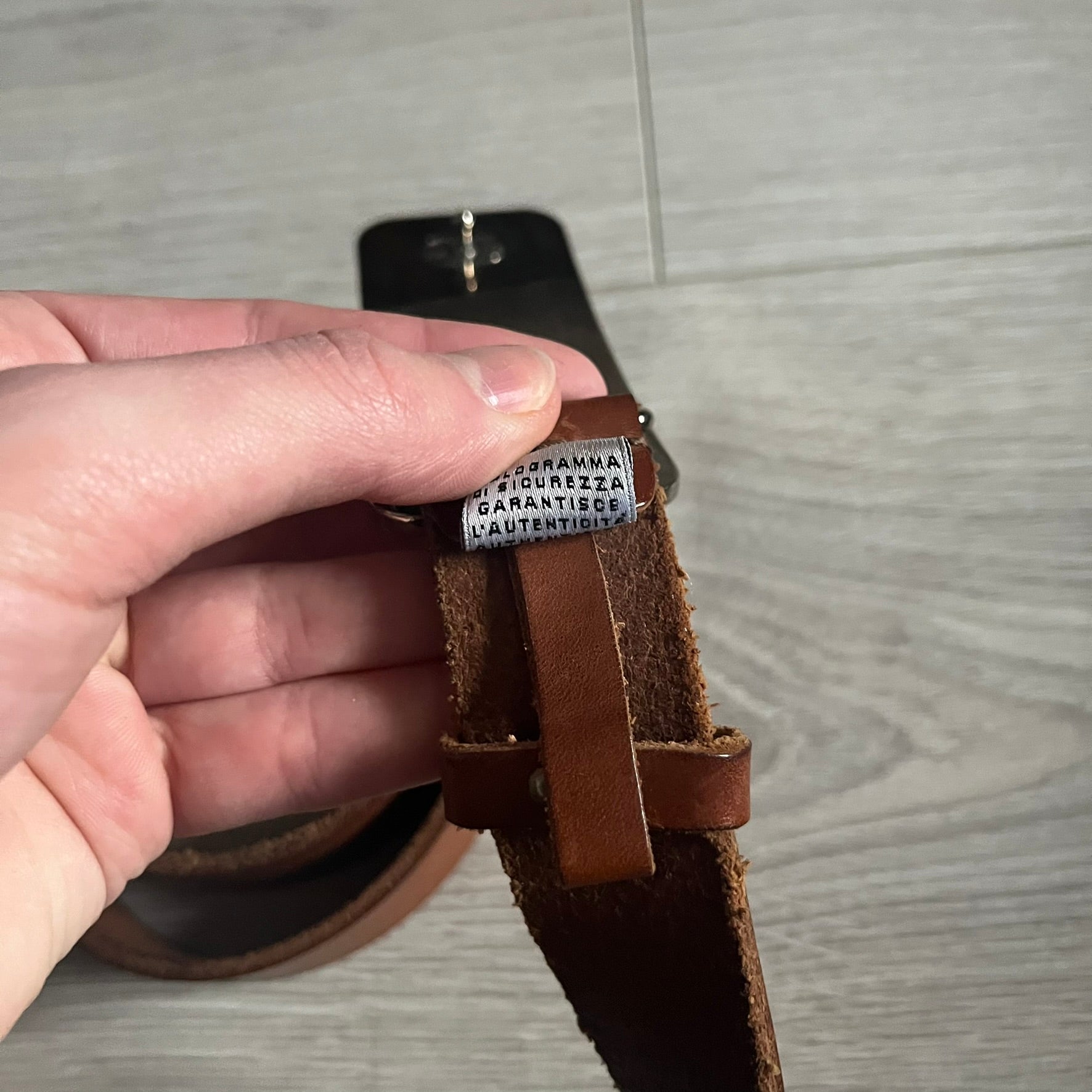 Dolce &amp; Gabbana Red &amp; Blue Leather Belt featuring a rectangular silver-tone buckle with a navy border. The buckle displays a large D&amp;G logo in blue with a red outline and “Dolce &amp; Gabbana” text in blue beneath. Finished with a brown leather strap.