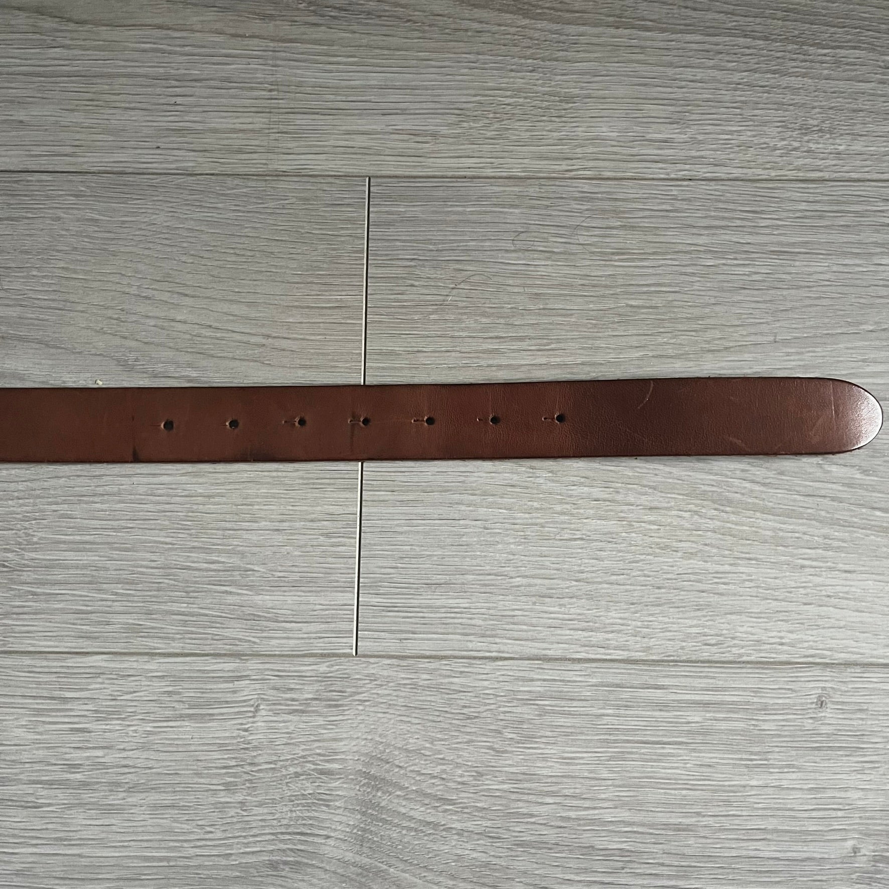 Dolce &amp; Gabbana Red &amp; Blue Leather Belt featuring a rectangular silver-tone buckle with a navy border. The buckle displays a large D&amp;G logo in blue with a red outline and “Dolce &amp; Gabbana” text in blue beneath. Finished with a brown leather strap.