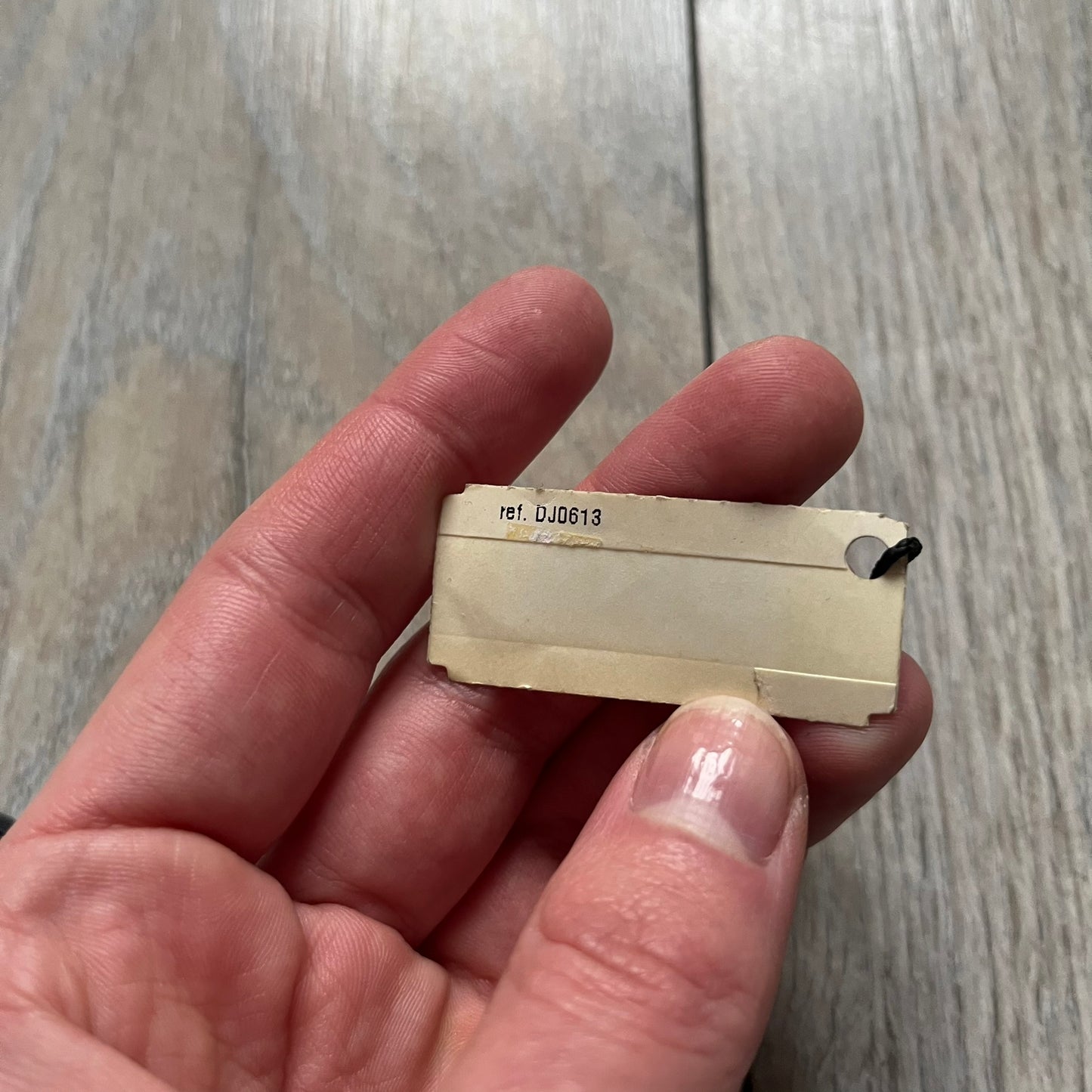 The Dolce &amp; Gabbana Room 13 Carabiner Necklace (DJ0613) is a large, heavy silver-tone necklace featuring a thick paperclip chain with oversized links. At the end of the chain is a large lobster clasp engraved with D&amp;G markings, connected to a branded carabiner. Hanging from the carabiner are two different keys with small D&amp;G logos and a black key identifier with a silver-tone plate engraved with “D&amp;G Dolce &amp; Gabbana Room 13.” The necklace comes with a large silver Dolce &amp; Gabbana dus