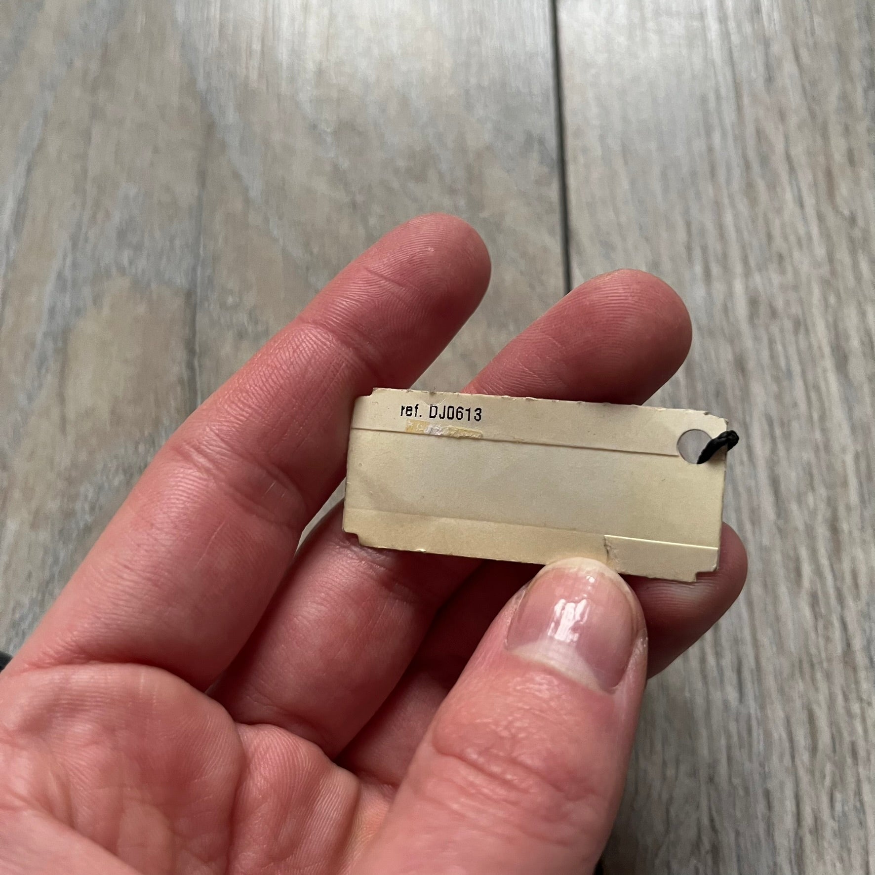 The Dolce &amp; Gabbana Room 13 Carabiner Necklace (DJ0613) is a large, heavy silver-tone necklace featuring a thick paperclip chain with oversized links. At the end of the chain is a large lobster clasp engraved with D&amp;G markings, connected to a branded carabiner. Hanging from the carabiner are two different keys with small D&amp;G logos and a black key identifier with a silver-tone plate engraved with “D&amp;G Dolce &amp; Gabbana Room 13.” The necklace comes with a large silver Dolce &amp; Gabbana dus