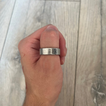 Dolce &amp; Gabbana SS04 SEX Ring is a stainless steel ring from the Spring/Summer 2004 collection. The exterior features an engraved D&amp;G logo on one side and “SEX” engraved on the opposite side. The interior is marked with a small D&amp;G logo. It has a thick band construction and polished finish.