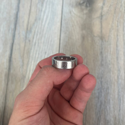 Dolce &amp; Gabbana SS04 SEX Ring is a stainless steel ring from the Spring/Summer 2004 collection. The exterior features an engraved D&amp;G logo on one side and “SEX” engraved on the opposite side. The interior is marked with a small D&amp;G logo. It has a thick band construction and polished finish.