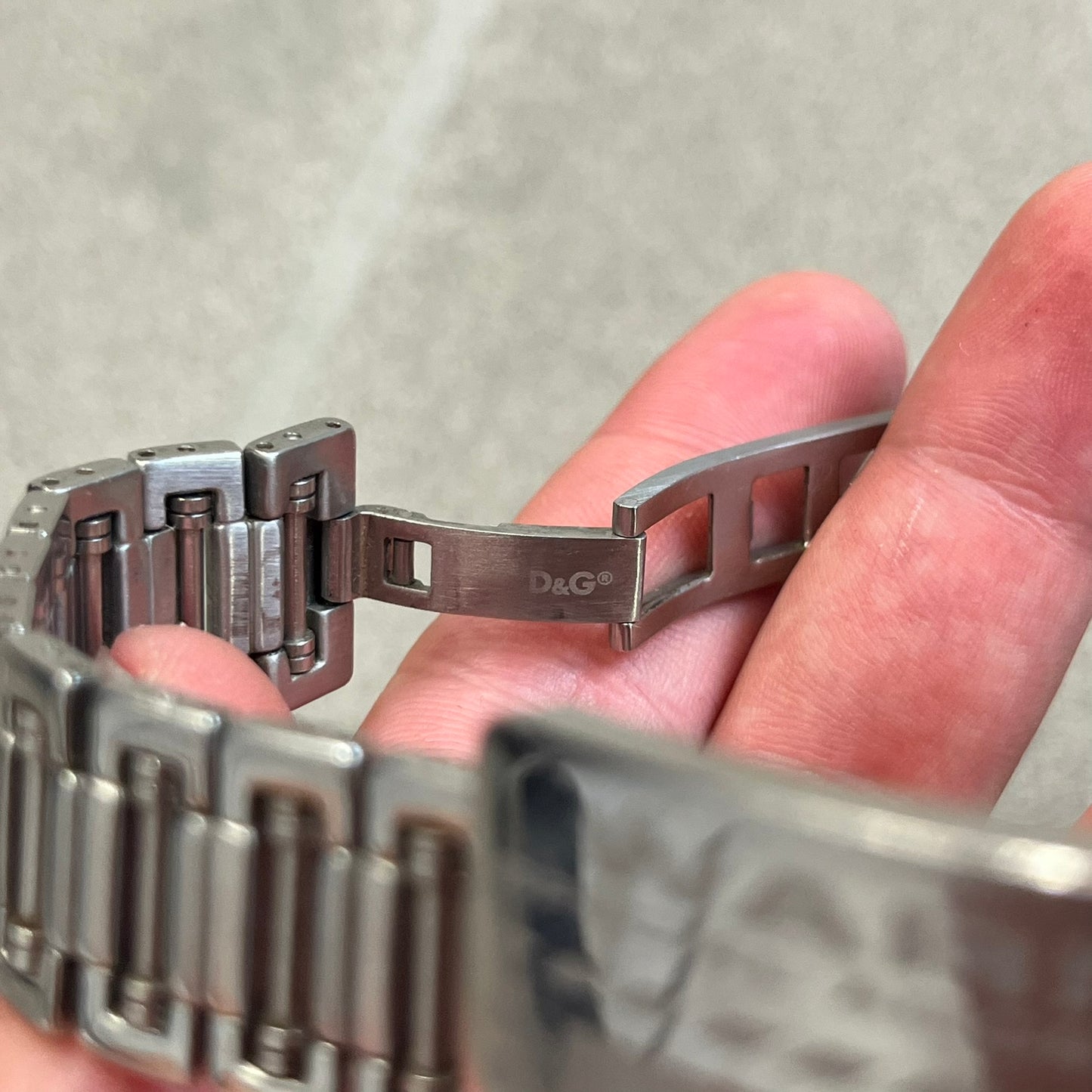 Dolce &amp; Gabbana Warning Stainless Steel Bracelet. From the Spring/Summer 2006 collection, this bracelet features a polished stainless steel design with a clip closure. The front plate displays “Warning Special Access Required” alongside D&amp;G Dolce &amp; Gabbana branding.