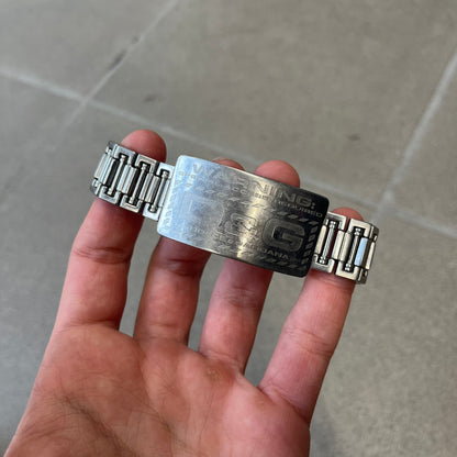Dolce &amp; Gabbana Warning Stainless Steel Bracelet. From the Spring/Summer 2006 collection, this bracelet features a polished stainless steel design with a clip closure. The front plate displays “Warning Special Access Required” alongside D&amp;G Dolce &amp; Gabbana branding.
