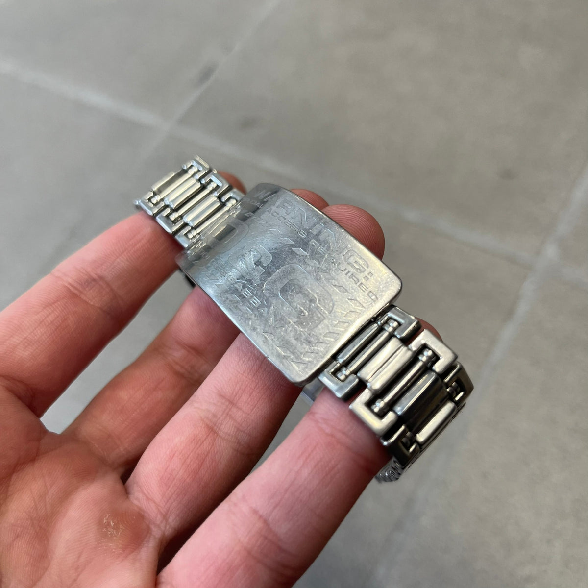 Dolce &amp; Gabbana Warning Stainless Steel Bracelet. From the Spring/Summer 2006 collection, this bracelet features a polished stainless steel design with a clip closure. The front plate displays “Warning Special Access Required” alongside D&amp;G Dolce &amp; Gabbana branding.