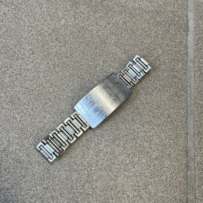 Dolce &amp; Gabbana Warning Stainless Steel Bracelet. From the Spring/Summer 2006 collection, this bracelet features a polished stainless steel design with a clip closure. The front plate displays “Warning Special Access Required” alongside D&amp;G Dolce &amp; Gabbana branding.