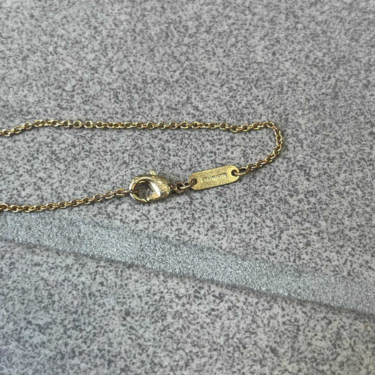 Dolce &amp; Gabbana SS25 Gold Cross Necklace features a gold-tone brass chain with a detailed 3D cross pendant depicting Jesus. A Dolce &amp; Gabbana plaque with “Made in Italy” text is positioned near the clasp. Comes with the original black box and certificate card.
