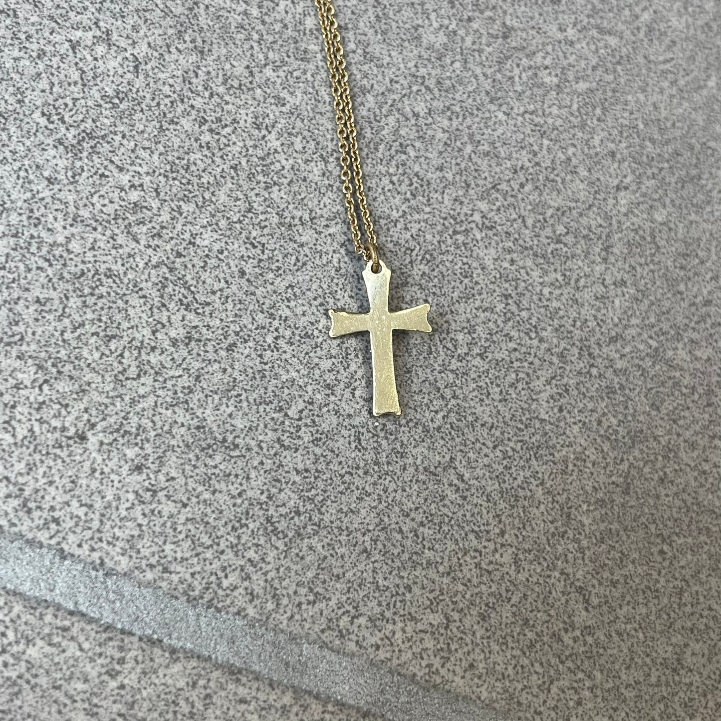 Dolce &amp; Gabbana SS25 Gold Cross Necklace features a gold-tone brass chain with a detailed 3D cross pendant depicting Jesus. A Dolce &amp; Gabbana plaque with “Made in Italy” text is positioned near the clasp. Comes with the original black box and certificate card.