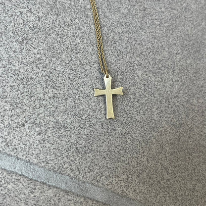 Dolce &amp; Gabbana SS25 Gold Cross Necklace features a gold-tone brass chain with a detailed 3D cross pendant depicting Jesus. A Dolce &amp; Gabbana plaque with “Made in Italy” text is positioned near the clasp. Comes with the original black box and certificate card.
