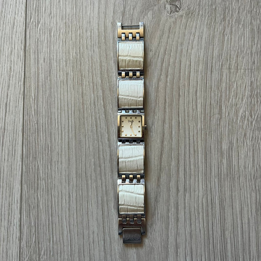 Dolce &amp; Gabbana white analog watch with a silver bracelet featuring white leather-like panels. The case seamlessly aligns with the width of the bracelet for a sleek, integrated look. A refined statement piece blending luxury design with modern elegance.