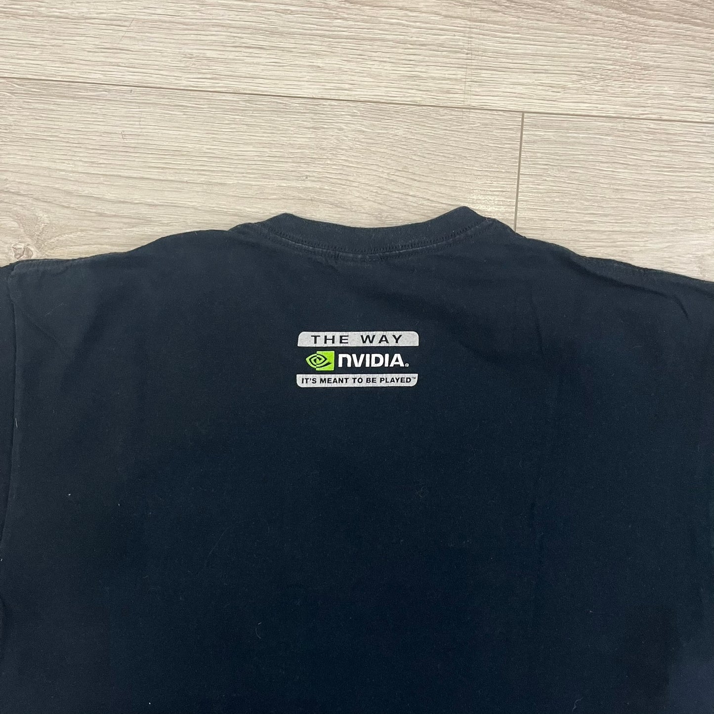 Dota 2 promo T-shirt from 2013 featuring a large graphic of Lina the Slayer with the official Dota 2 logo beneath. Printed on a Gildan Heavy Cotton blank, it includes a small Nvidia logo on the back as part of the original PC gaming promotion. A rare piece of early Dota 2 merchandise.&nbsp;