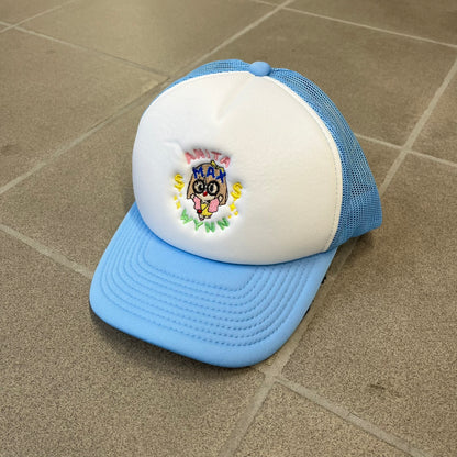Drake Anita Max Wynn Blue Trucker Cap with a white front panel and baby blue sides and cap, featuring a collection of graphics including a woman with an oversized head, two yellow dollar signs, and “ANITA” in pink, “MAX” in blue, and “WYNN” in green. Designed with a mesh back for breathability, a snapback closure for adjustability, and polyester construction to keep the head cool.