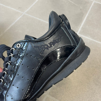 Dsquared2 2010's Multi Fabric Legendary Sneakers are constructed from tonal velvet, patent leather, metal eyelets and a woven rubber sole. They feature a red embroidered Canadian leaf on the tongue, a metal Dsquared2 plaque at the base of the laces, and an embroidered black Dsquared2 logo.