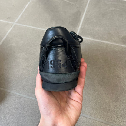 Dsquared2 2010's Multi Fabric Legendary Sneakers are constructed from tonal velvet, patent leather, metal eyelets and a woven rubber sole. They feature a red embroidered Canadian leaf on the tongue, a metal Dsquared2 plaque at the base of the laces, and an embroidered black Dsquared2 logo.
