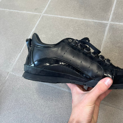 Dsquared2 2010's Multi Fabric Legendary Sneakers are constructed from tonal velvet, patent leather, metal eyelets and a woven rubber sole. They feature a red embroidered Canadian leaf on the tongue, a metal Dsquared2 plaque at the base of the laces, and an embroidered black Dsquared2 logo.
