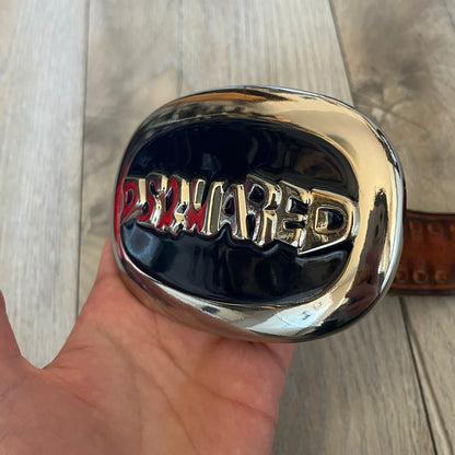 Dsquared2 Big Navy Plaque Leather Belt is a leather belt featuring a large oval metal buckle with a silver-tone frame and navy enamel center. The buckle displays DSQUARED2 text in the middle, while the strap includes stamped branding and product details. Made from brown leather, the belt is size small.