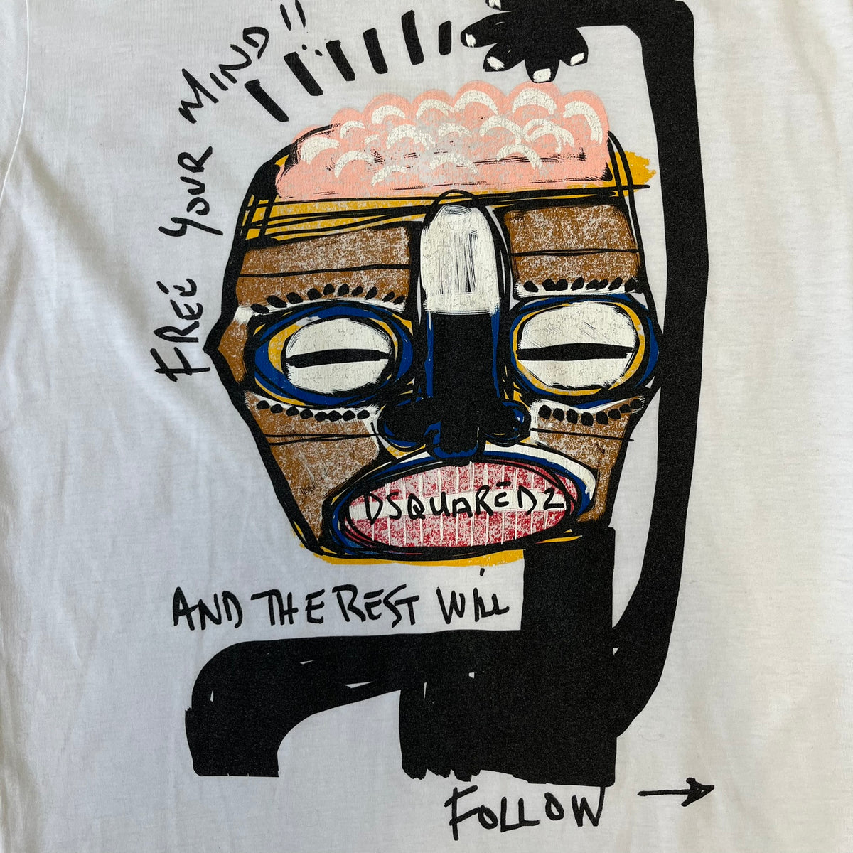 Dsquared2 SS2015 “Free Your Mind” T-shirt is a white cotton tee with a front graphic that features a black Basquiat-inspired figure scratching his brain with “Free Your Mind and the Rest Will Follow” text in a contrasting design. The piece is made in Italy and 100% cotton.