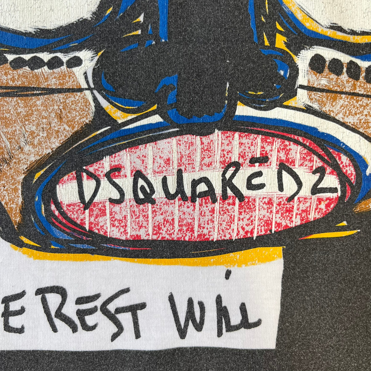 Dsquared2 SS2015 “Free Your Mind” T-shirt is a white cotton tee with a front graphic that features a black Basquiat-inspired figure scratching his brain with “Free Your Mind and the Rest Will Follow” text in a contrasting design. The piece is made in Italy and 100% cotton.