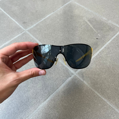 Emporio Armani 2000's Shield Yellow Sunglasses feature a black shield-style front with a single continuous lens and yellow temples. The temples have black Emporio Armani eagle logos, with model EA 9242/S SVG95. Made in Italy and comes with the original red case.
