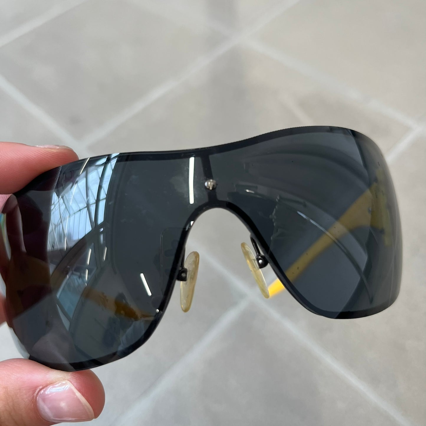 Emporio Armani 2000's Shield Yellow Sunglasses feature a black shield-style front with a single continuous lens and yellow temples. The temples have black Emporio Armani eagle logos, with model EA 9242/S SVG95. Made in Italy and comes with the original red case.
