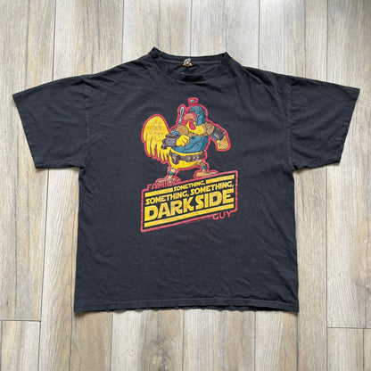 Family Guy 2009 Star Wars "Something Darkside" Tee is a washed black/gray T-shirt made on a Delta Pro Weight blank. The front features Ernie the Giant Chicken dressed as Boba Fett above yellow Star Wars-style “Something, Something, Something, Dark Side” text with a red Family Guy outline surrounding the graphic. Small 2009 licensing details are printed below the design.