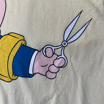 Family Guy 2012 Peter Griffin #1 Dad Tee features a yellow T-shirt with a front graphic of Peter Griffin wearing a helmet and elbow and knee protectors while running with a pair of scissors. A “#1 Dad” text is printed underneath the graphic. Includes a 2012 licensed neck tag.
