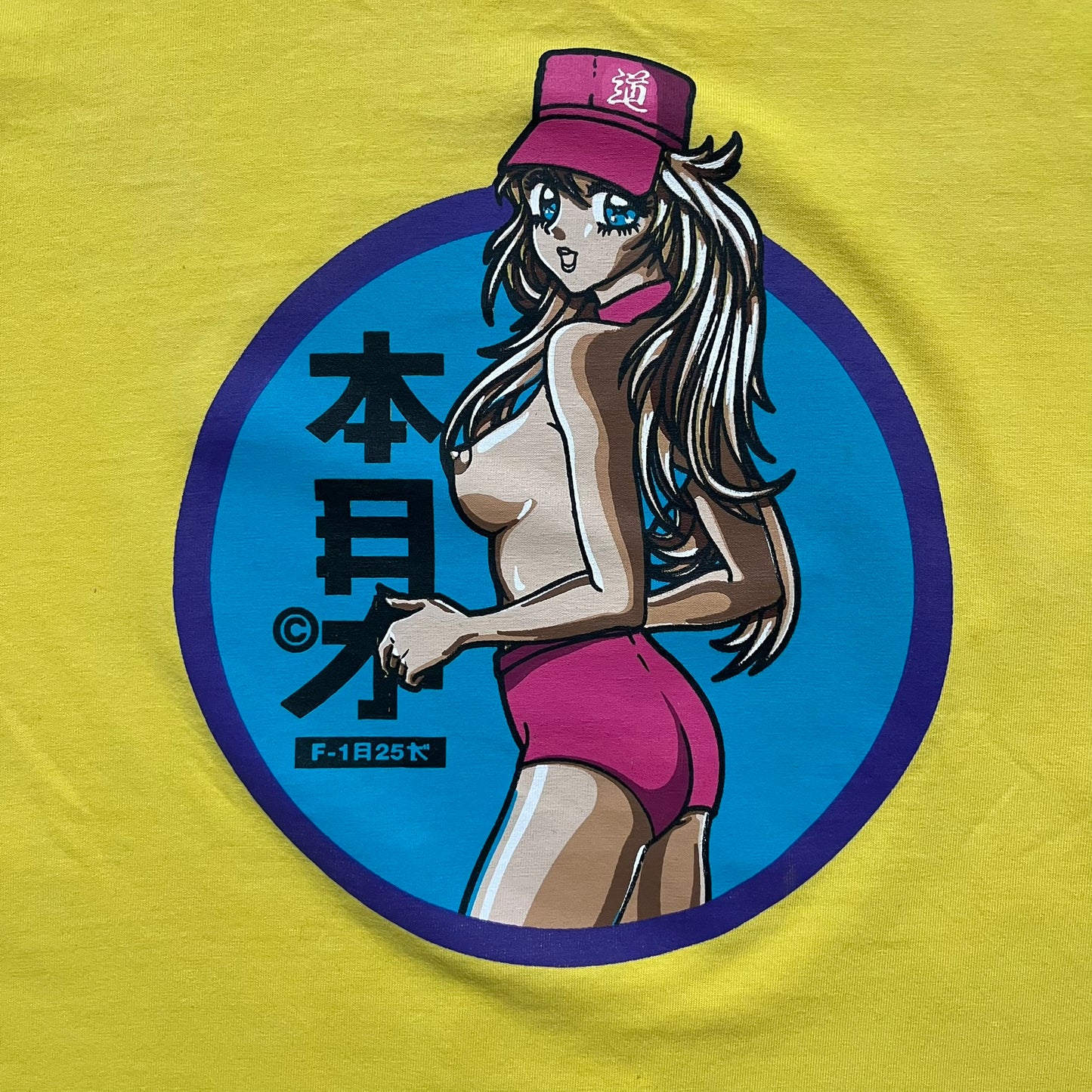 Fishbone Anime Girl 2000’s Yellow Tee is a yellow T-shirt featuring a large blue circle on the front with an anime-style naked girl wearing a pink hat and shorts. Made in the 2000s, it includes a black Fishbone neck tag.